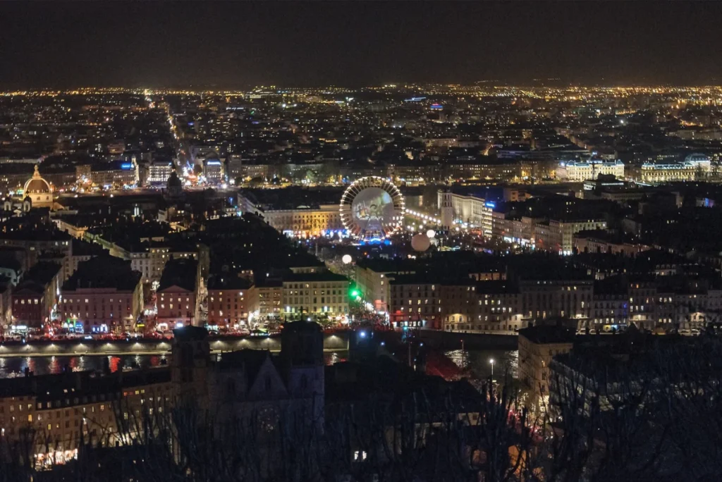 Lyon lit up at night during the Fête des Lumières, seen from Fourvière